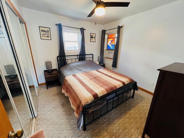 bedroom featuring light carpet, a closet, cooling unit, baseboards, and ceiling fan