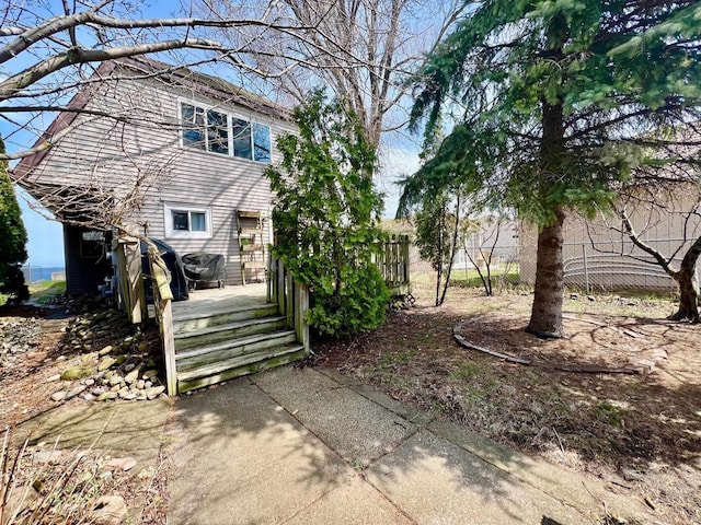 exterior space with fence and a wooden deck