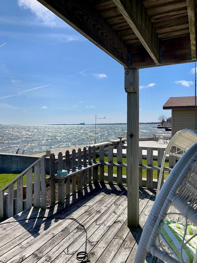 wooden deck with a water view