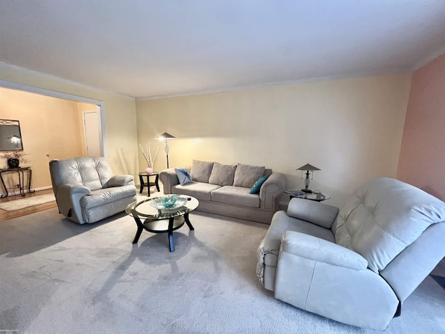 living area with carpet and crown molding