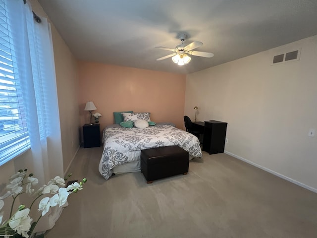 bedroom featuring visible vents, a ceiling fan, and baseboards
