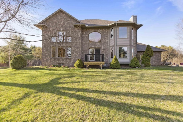 6728 Frith Rd, Smiths Creek, MI 48079 - rear view of property with a lawn, a chimney, and brick siding