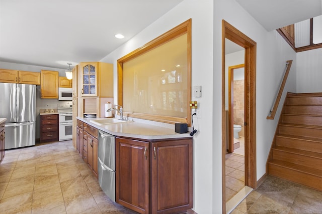 6728 Frith Rd, Smiths Creek, MI 48079 - kitchen with stainless steel appliances, light countertops, glass insert cabinets, and a sink