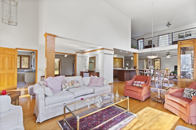 6728 Frith Rd, Smiths Creek, MI 48079 - living area featuring wood finished floors, ceiling fan, and a high ceiling