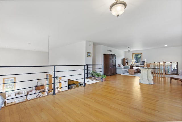 6728 Frith Rd, Smiths Creek, MI 48079 - hallway featuring an upstairs landing, a wealth of natural light, and light wood-style flooring