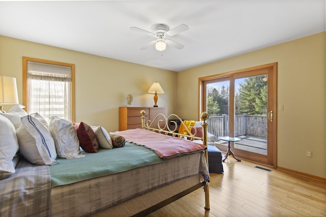 6728 Frith Rd, Smiths Creek, MI 48079 - bedroom featuring visible vents, access to outside, multiple windows, and light wood-style flooring