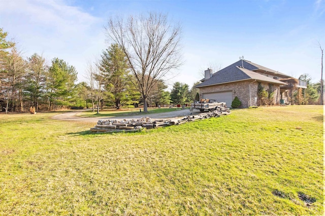 6728 Frith Rd, Smiths Creek, MI 48079 - view of yard with a garage and aphalt driveway