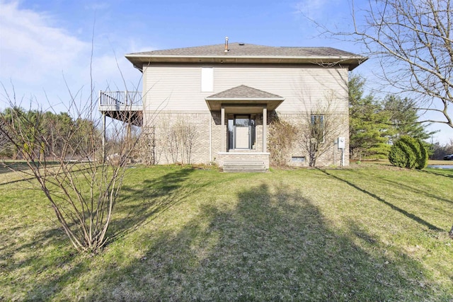 6728 Frith Rd, Smiths Creek, MI 48079 - back of house featuring roof with shingles, a yard, and brick siding