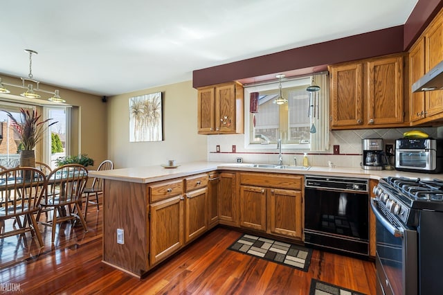 kitchen with dark wood-style floors, light countertops, dishwasher, a peninsula, and brown cabinetry