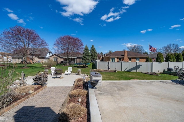 view of patio / terrace featuring a residential view and fence