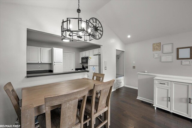 dining area featuring high vaulted ceiling, a chandelier, baseboards, dark wood-type flooring, and recessed lighting