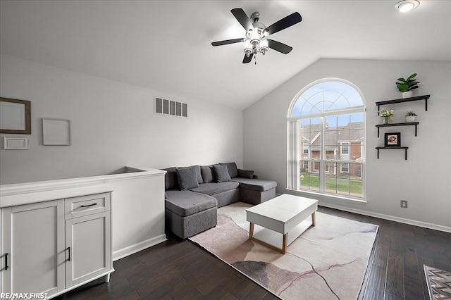 living room with vaulted ceiling, a ceiling fan, baseboards, dark wood-type flooring, and visible vents