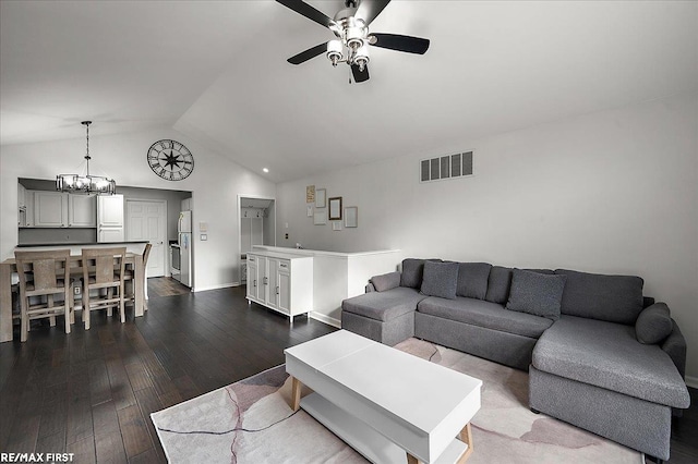 living room featuring ceiling fan with notable chandelier, vaulted ceiling, visible vents, and dark wood-type flooring