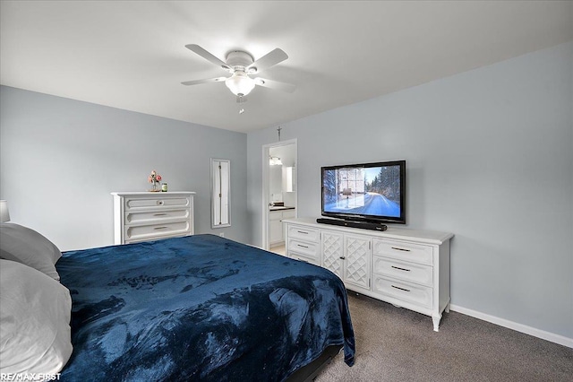 bedroom with dark carpet, ceiling fan, baseboards, and ensuite bath