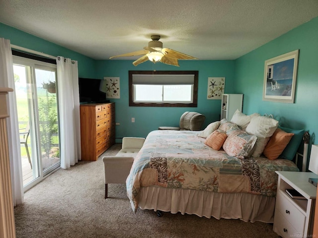 bedroom featuring a textured ceiling, access to exterior, light colored carpet, and ceiling fan