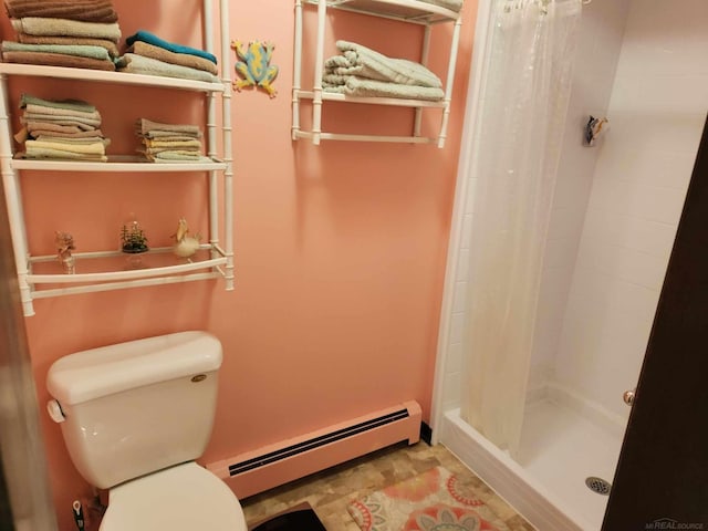 bathroom featuring a baseboard heating unit, a shower stall, and toilet