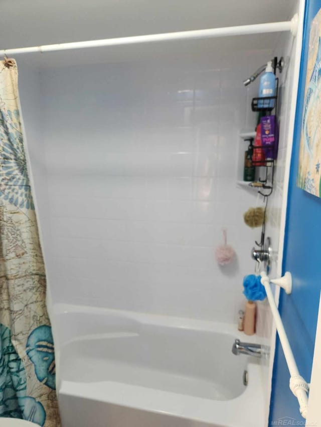 full bathroom with shower / bath combo with shower curtain
