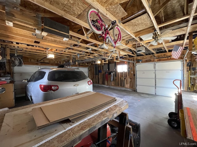 garage featuring a ceiling fan and a garage door opener
