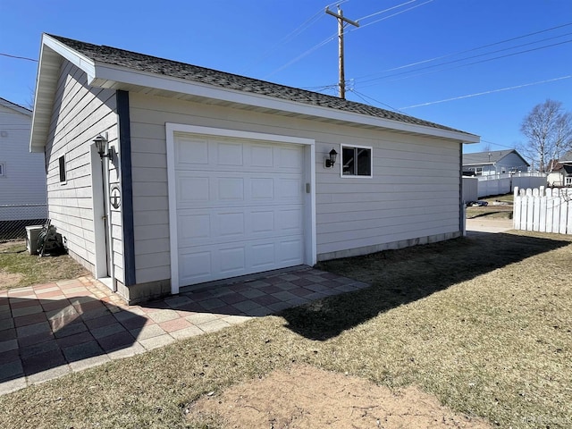 garage with fence