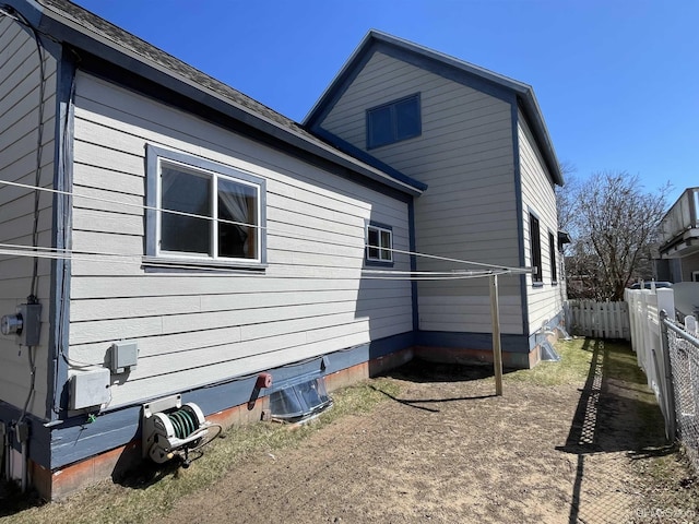 view of side of property with fence