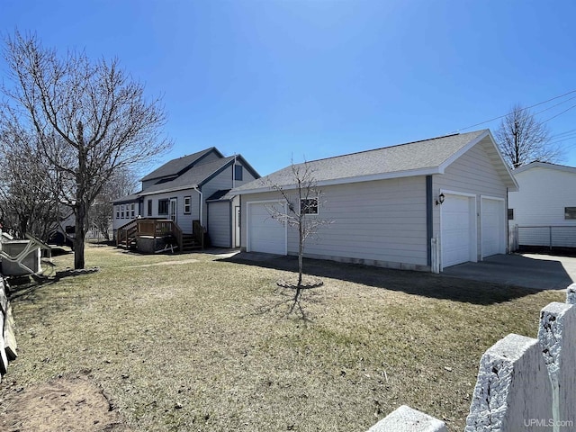 view of home's exterior featuring a yard and a garage