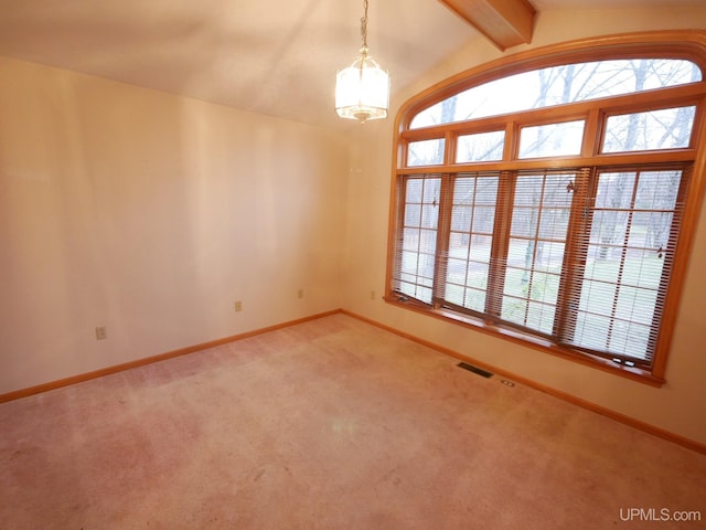 spare room with light carpet, vaulted ceiling with beams, visible vents, and baseboards