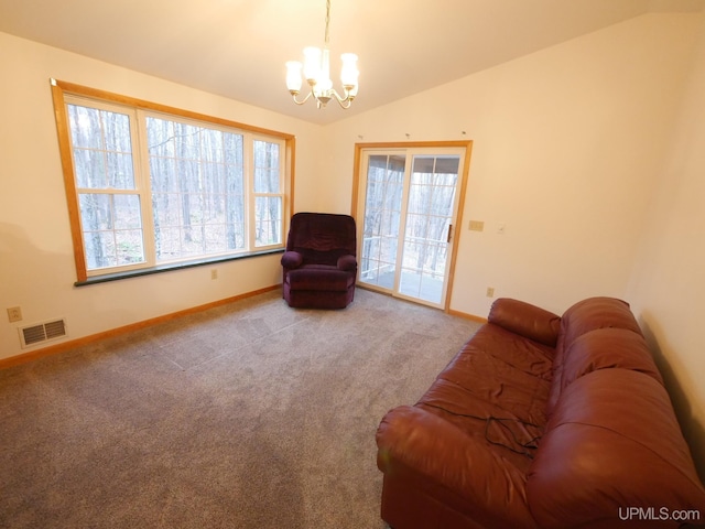living area featuring vaulted ceiling, visible vents, baseboards, and an inviting chandelier