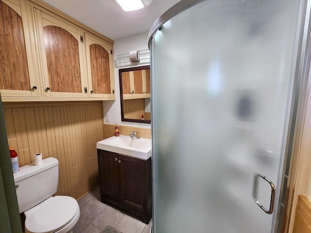 full bath featuring vanity, tile patterned flooring, a shower stall, and toilet