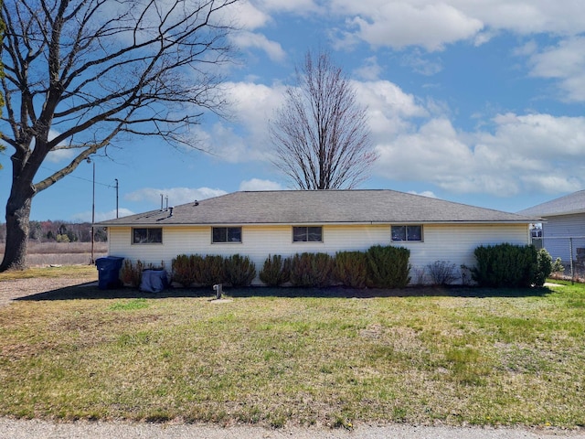view of side of property featuring a yard