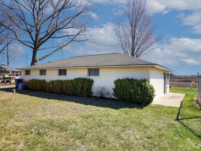 view of home's exterior featuring a lawn