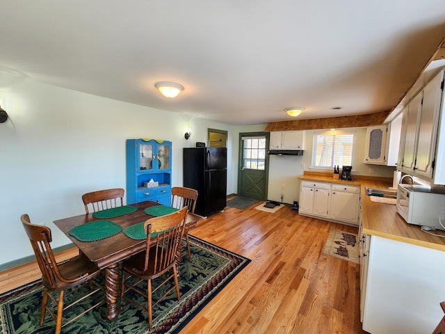 dining room featuring light wood finished floors