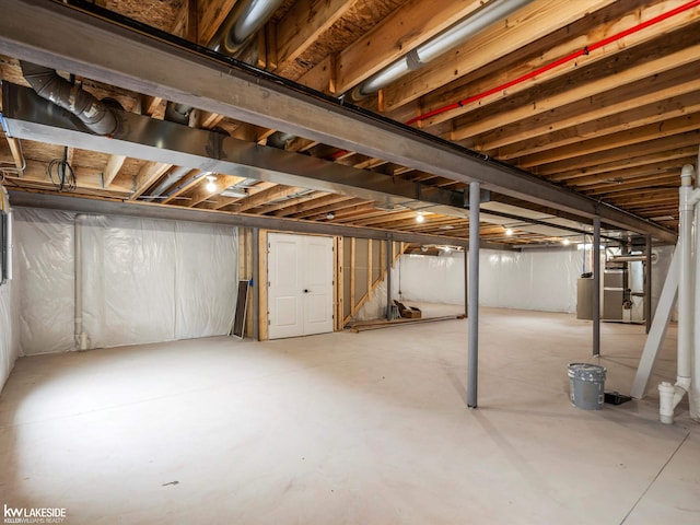 unfinished below grade area with water heater and stairs