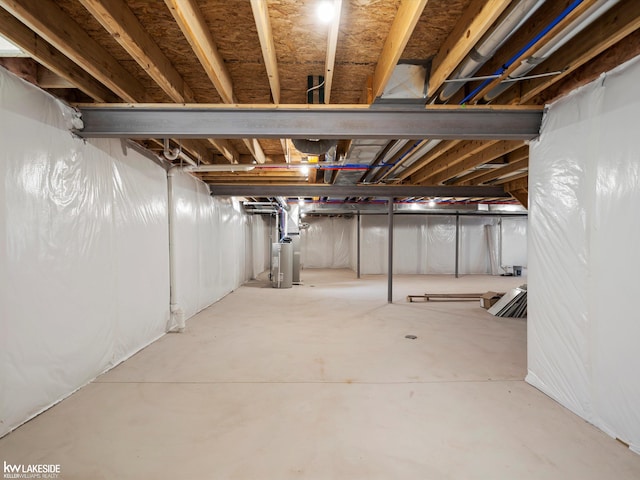 unfinished below grade area featuring gas water heater