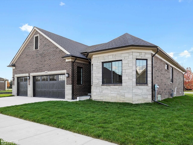 view of front of house with a front lawn, concrete driveway, stone siding, brick siding, and a garage