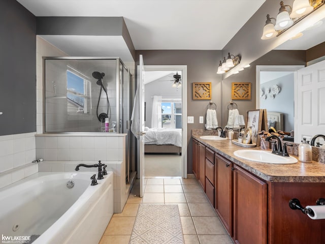 bathroom featuring a shower stall, ensuite bath, a ceiling fan, and a sink