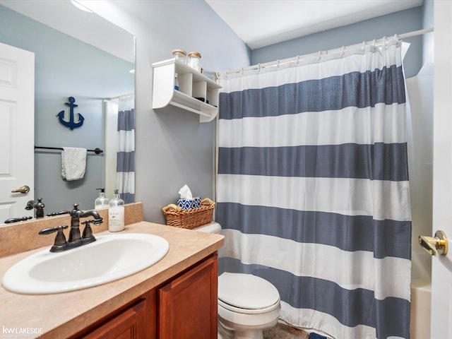 full bathroom with toilet and vanity