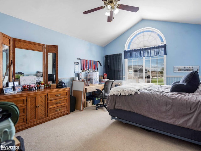 bedroom with light colored carpet, ceiling fan, and high vaulted ceiling