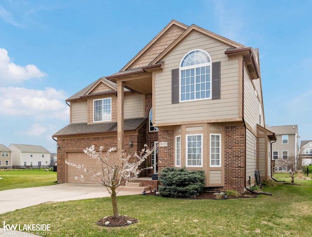 traditional home with brick siding, driveway, and a garage