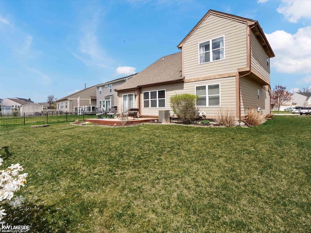 back of house featuring a yard, central AC, a patio, and fence