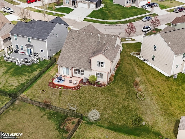 birds eye view of property with a residential view