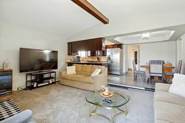 living room featuring light carpet and vaulted ceiling with beams