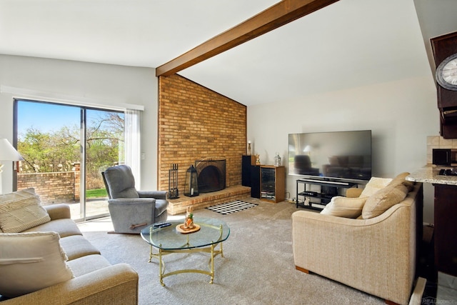 carpeted living room with a fireplace and vaulted ceiling with beams