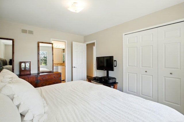 bedroom with a closet and visible vents