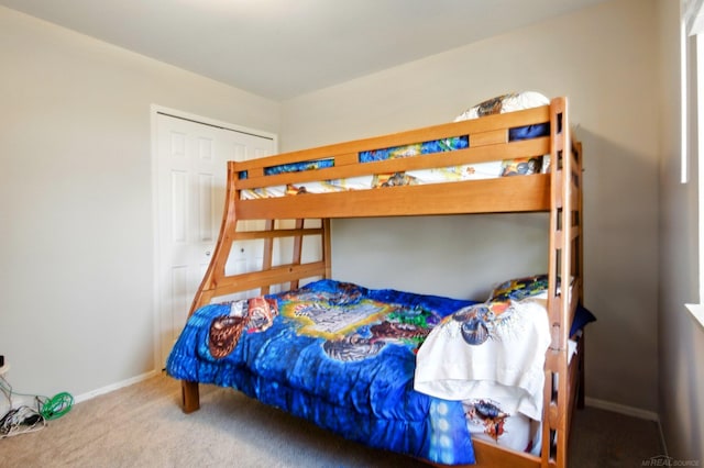 carpeted bedroom with baseboards
