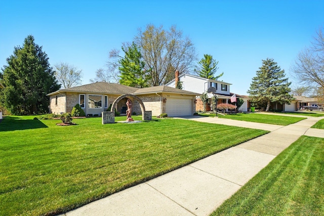 view of front facade featuring driveway, brick siding, a front yard, and a garage