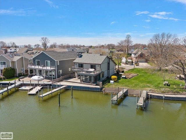 dock area featuring a water view and a residential view
