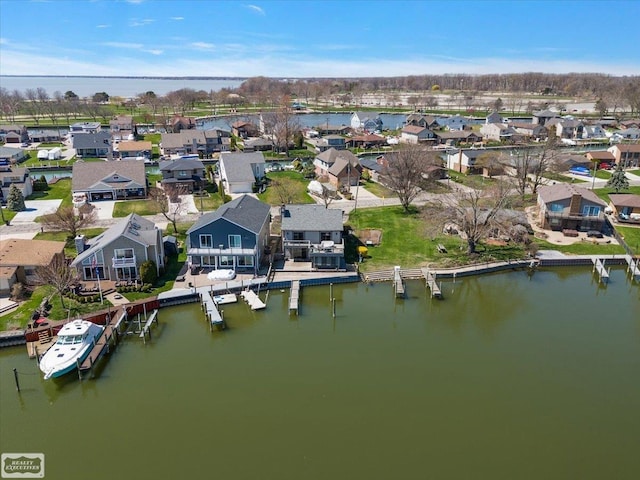 aerial view with a residential view and a water view
