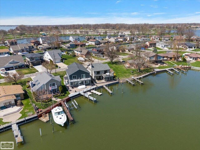 aerial view with a water view and a residential view