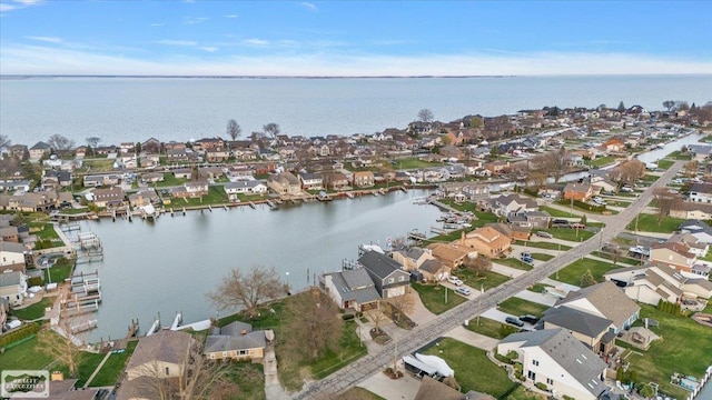 bird's eye view with a water view and a residential view