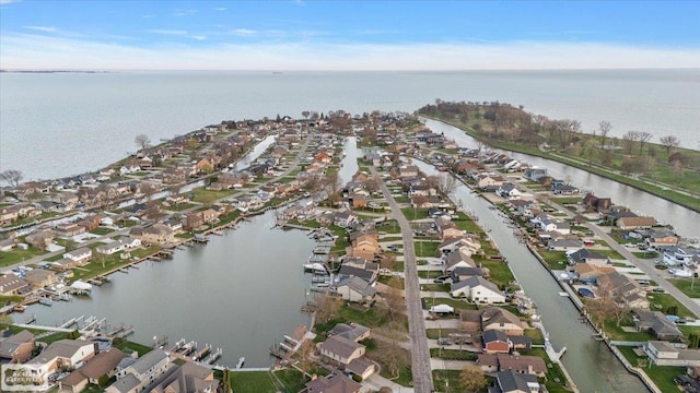 birds eye view of property featuring a residential view and a water view